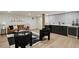 Finished basement featuring a living area and bar with wooden post and stainless steel refrigerator at 2327 Doreen Ne Ct, Atlanta, GA 30345