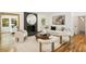 Bright living room with a fireplace, contemporary art, hardwood floors and lots of natural light at 2327 Doreen Ne Ct, Atlanta, GA 30345
