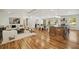 Open concept living area with hardwood floors, fireplace, modern furniture, and large windows allowing for ample natural light at 2327 Doreen Ne Ct, Atlanta, GA 30345