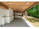 Outdoor patio with white brick walls and wooden ceiling at 2327 Doreen Ne Ct, Atlanta, GA 30345
