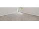 Bright, carpeted bedroom with window views and multiple electrical outlets at 5103 Woodline View Ln, Auburn, GA 30011