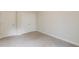 Neutral bedroom with plush carpeting and double door closet creating a cozy space at 5103 Woodline View Ln, Auburn, GA 30011