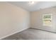 Cozy bedroom features a well-lit space, and neutral carpeting at 5103 Woodline View Ln, Auburn, GA 30011