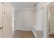 Bright entryway featuring a built-in storage bench and access to a bathroom at 5103 Woodline View Ln, Auburn, GA 30011