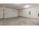 Spacious garage with concrete flooring and automatic garage door opener at 5103 Woodline View Ln, Auburn, GA 30011