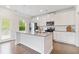 Kitchen with stainless steel appliances, white cabinets, subway tile backsplash, and granite countertops at 5103 Woodline View Ln, Auburn, GA 30011