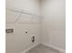 Functional laundry room with utility connections and built in shelving at 5103 Woodline View Ln, Auburn, GA 30011