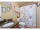 Cozy bathroom featuring a shower with a floral curtain at 96 Grover Way, Dallas, GA 30157