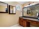 Bathroom with wood vanity and large mirror at 96 Grover Way, Dallas, GA 30157
