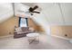 A bonus room with a white, wood-paneled ceiling offers a cozy couch and modern coffee table at 96 Grover Way, Dallas, GA 30157