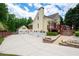 Expansive driveway leading to the home's multiple garages and backyard decks at 96 Grover Way, Dallas, GA 30157