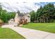 Well-manicured front yard with a long driveway leading to a charming home at 96 Grover Way, Dallas, GA 30157