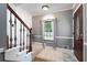 Welcoming home foyer featuring an upgraded front door, tiled floors, and stairs at 96 Grover Way, Dallas, GA 30157