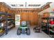 This partially finished garage offers a lawn mower and shelving for storage and projects at 96 Grover Way, Dallas, GA 30157