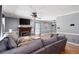 Open-concept living room featuring a fireplace, hardwood floors, and comfortable seating at 96 Grover Way, Dallas, GA 30157