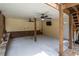 A covered patio features ceiling fans and a tv with a brick and stone retaining wall at 96 Grover Way, Dallas, GA 30157