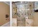 Bathroom features a glass shower, a tile floor, and a built-in shower caddy at 96 Grover Way, Dallas, GA 30157