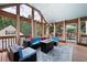Relaxing sunroom with comfortable seating, a modern fire pit, and lots of natural light at 96 Grover Way, Dallas, GA 30157