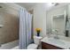 Neat bathroom featuring a tiled shower-tub, a modern vanity, and fresh neutral tones at 1671 Hammock Dr, Smyrna, GA 30080