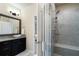 Bathroom featuring granite countertop, vessel sink, glass shower with seat at 1671 Hammock Dr, Smyrna, GA 30080