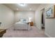 Cozy bedroom with neutral carpet, a comfortable bed, and access to an ensuite bathroom at 1671 Hammock Dr, Smyrna, GA 30080