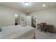 Spacious bedroom featuring soft carpet, neutral walls, a small desk, and a comfortable bed at 1671 Hammock Dr, Smyrna, GA 30080