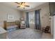 Cozy bedroom with a crib, rocking chair, and charming blue accents at 1671 Hammock Dr, Smyrna, GA 30080
