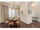 Cozy dining room with a round wood table, chandelier, and light-filled windows at 1671 Hammock Dr, Smyrna, GA 30080
