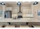 Modern kitchen featuring a spacious island with granite countertops and stainless steel appliances at 1671 Hammock Dr, Smyrna, GA 30080