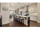 Bright kitchen with white cabinets, stainless steel appliances, and a large center island with seating at 1671 Hammock Dr, Smyrna, GA 30080