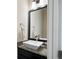 Stylish powder room featuring granite countertop and modern vessel sink at 1671 Hammock Dr, Smyrna, GA 30080