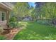Spacious backyard boasts green lawns, a fountain, mature trees, and lush landscaping at 15 Northwood Ne Ave, Atlanta, GA 30309