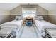 Cozy bedroom featuring two beds, a central table, and a neutral color scheme for relaxation at 15 Northwood Ne Ave, Atlanta, GA 30309