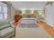 Stylish bedroom offering a comfortable bed, dresser, and a cozy armchair near a window at 15 Northwood Ne Ave, Atlanta, GA 30309