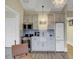 Charming kitchenette with gray cabinets, stainless steel appliances, patterned backsplash, and farmhouse sink at 15 Northwood Ne Ave, Atlanta, GA 30309