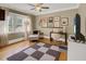 Well-lit home office with a large window, desk, comfortable seating, and stylish decor at 15 Northwood Ne Ave, Atlanta, GA 30309