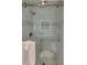 Elegant glass shower featuring subway tile, a built-in seat, and a niche for storage at 15 Northwood Ne Ave, Atlanta, GA 30309