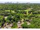 An elevated aerial view of a home highlighting the proximity to the city skyline and local amenities at 1601 Marlbrook Ne Dr, Atlanta, GA 30307