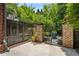 Enclosed backyard featuring a decorative gate, brick pillars and mature landscaping at 1601 Marlbrook Ne Dr, Atlanta, GA 30307