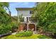 Inviting backyard with a patio, an upper deck, mature trees and professionally landscaped garden at 1601 Marlbrook Ne Dr, Atlanta, GA 30307