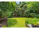 Well-maintained backyard featuring lush greenery, manicured lawn, and mature trees providing a peaceful retreat at 1601 Marlbrook Ne Dr, Atlanta, GA 30307