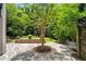 Secluded backyard patio with stone pavers and lush landscaping, perfect for outdoor relaxation and entertainment at 1601 Marlbrook Ne Dr, Atlanta, GA 30307