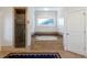 Relaxing bathroom features a soaking tub, a glass-enclosed shower, and neutral tile surround at 1601 Marlbrook Ne Dr, Atlanta, GA 30307
