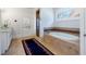 Bright bathroom features a soaking tub, a glass-enclosed shower, and a vanity with marble countertop at 1601 Marlbrook Ne Dr, Atlanta, GA 30307