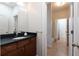 Bathroom featuring a dark vanity, and tile flooring, providing a functional and accessible space at 1601 Marlbrook Ne Dr, Atlanta, GA 30307