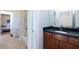 Bathroom featuring a dark vanity, tile flooring, and easy access to the shower and toilet at 1601 Marlbrook Ne Dr, Atlanta, GA 30307