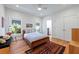 Cozy bedroom with hardwood floors, natural light, and neutral decor, creating a relaxing space at 1601 Marlbrook Ne Dr, Atlanta, GA 30307