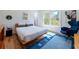 Bright bedroom with a large window, hardwood floors, and stylish furnishings at 1601 Marlbrook Ne Dr, Atlanta, GA 30307