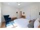 Well-lit bedroom with hardwood floors, modern lighting, and neutral walls at 1601 Marlbrook Ne Dr, Atlanta, GA 30307