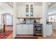 This butler's pantry is equipped with custom cabinets and a wine fridge at 1601 Marlbrook Ne Dr, Atlanta, GA 30307